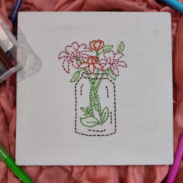 Hand embroidered canvas with flower vase